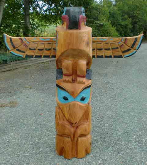 Thunderbird and Wolf Totem Pole Carving